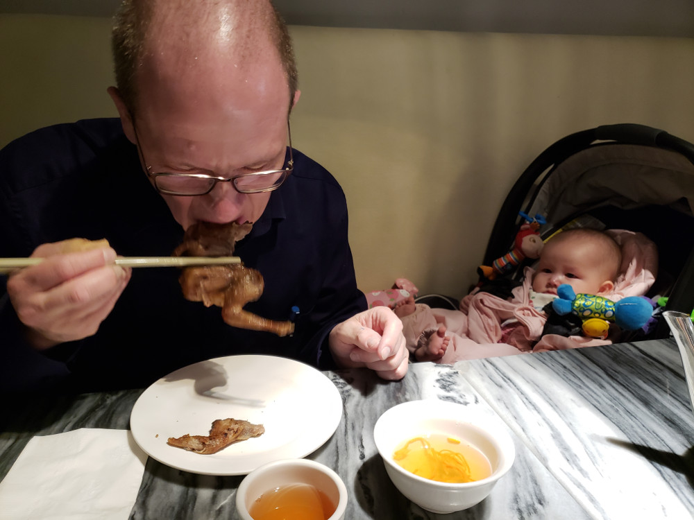 Papa Zesser tries Vietnamese spicy chicken while Baby Asta watches and wonders: "Where's my milk?!"