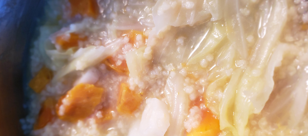 Close-up photo of baby food before it is pureed, including sweet potato, nagaimo, millet and cabbage.