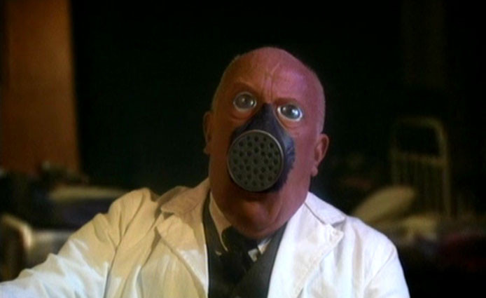 Screenshot of a man turning into a "gas mask creature" from Doctor Who (2005) Series One, Episode Nine, "The Empty Child".